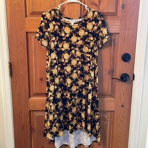 LuLaRoe flowy dress with bursts of sunshine flowers on a black background